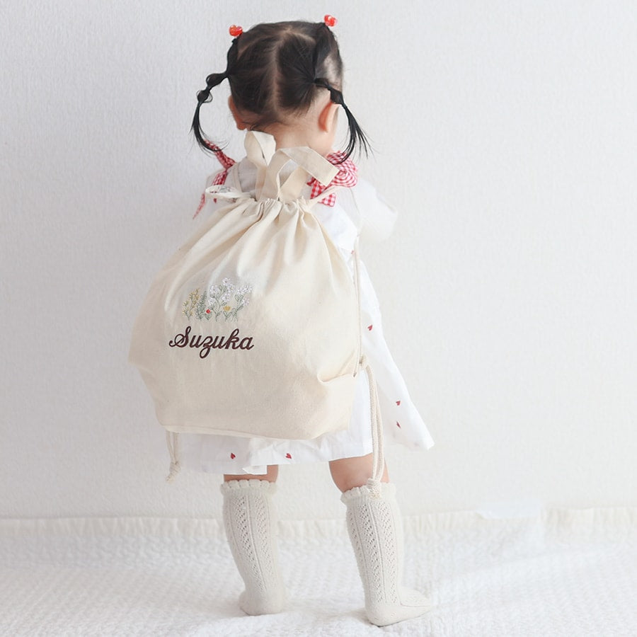 刺繍名入れ 1歳誕生日 一升餅 名前入りリュック・生成り・アンダンテ
