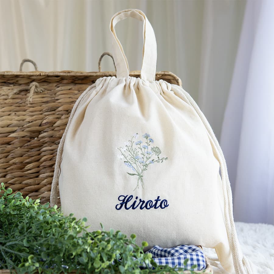 刺繍名入れ 1歳誕生日 一升餅 名前入りリュック・生成り・フルリ・ブルー