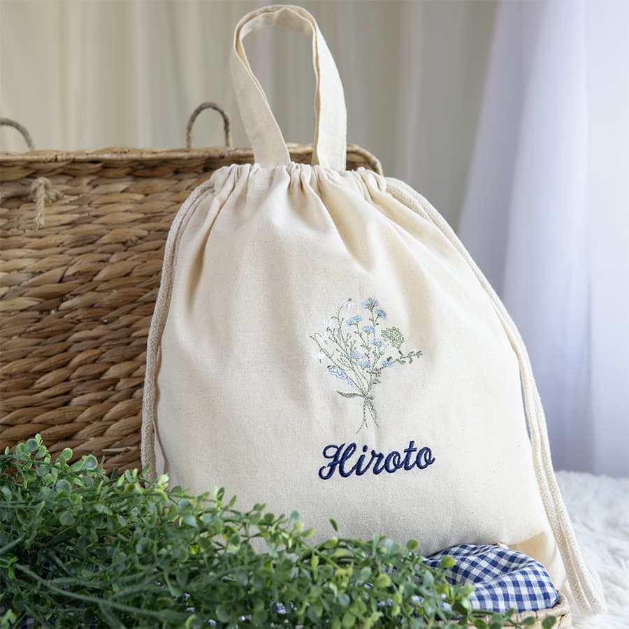 刺繍名入れ 1歳誕生日 一升餅 名前入りリュック・生成り・フルリ・ブルー