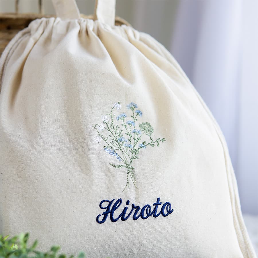 刺繍名入れ 1歳誕生日 一升餅 名前入りリュック・生成り・フルリ・ブルー