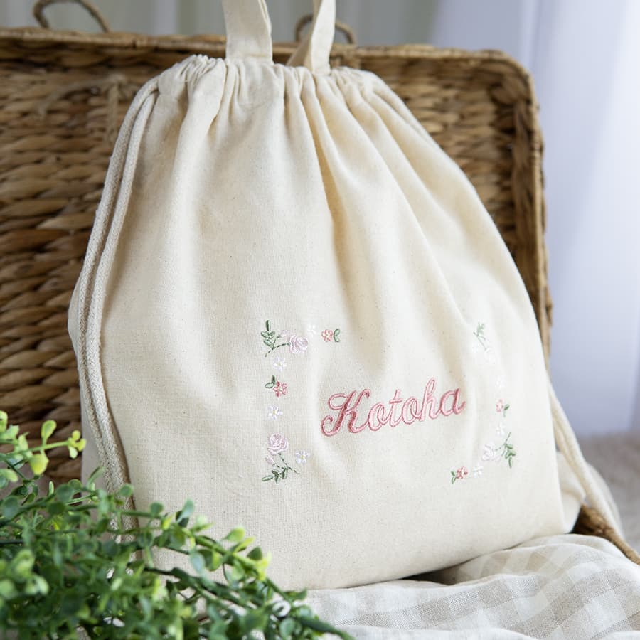 刺繍名入れ 1歳誕生日 一升餅 名前入りリュック・生成り・フルールミニョン・ピンク