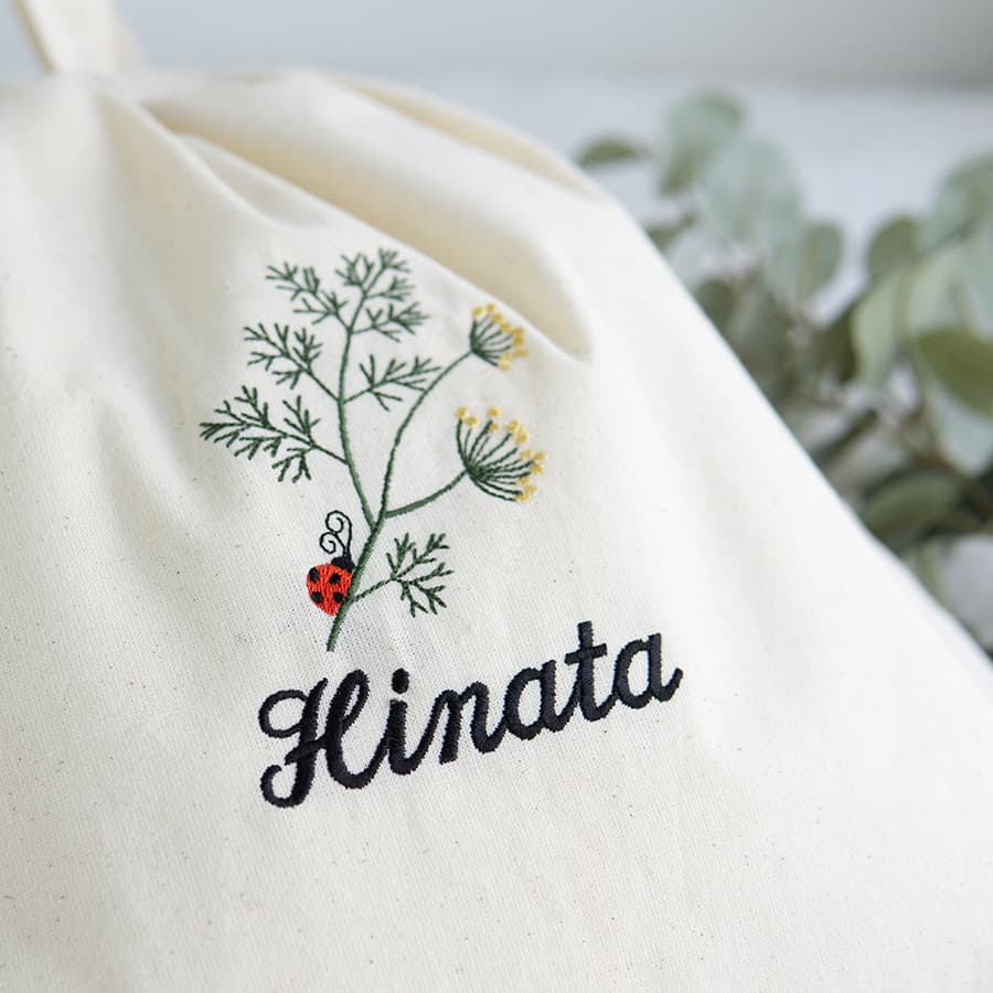 刺繍名入れ 1歳誕生日 一升餅 名前入りリュック・生成り・アネット