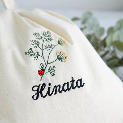 刺繍名入れ 1歳誕生日 一升餅 名前入りリュック・生成り・アネット