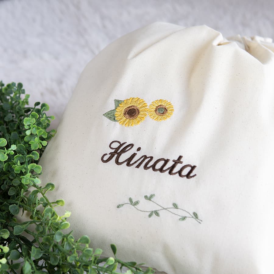 刺繍名入れ 1歳誕生日 一升餅 名前入りリュック・生成り・アンジュエ