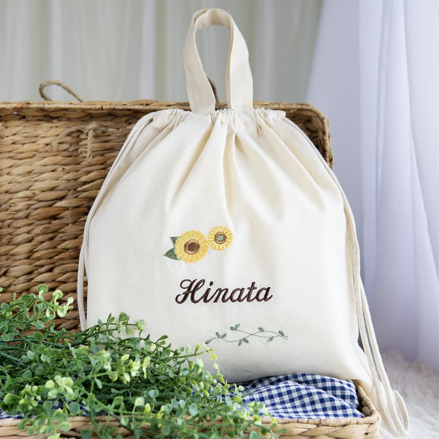 刺繍名入れ 1歳誕生日 一升餅 名前入りリュック・生成り・アンジュエ