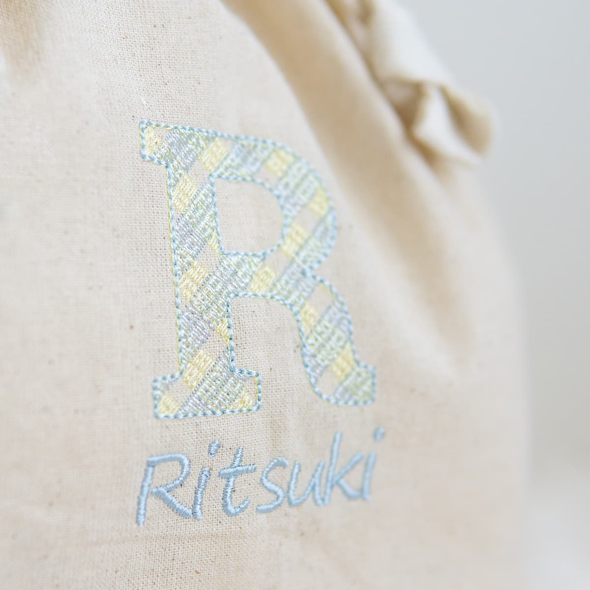 名前入りおむつ巾着・チェック刺繍