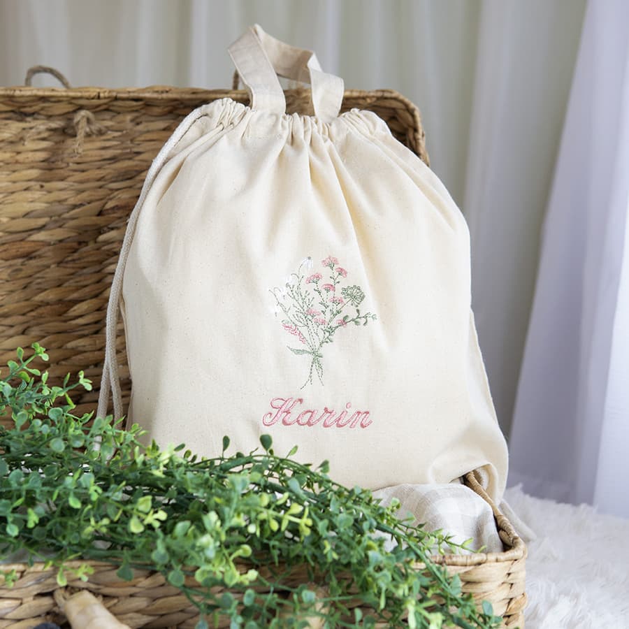 刺繍名入れ 1歳誕生日 一升餅 名前入りリュック・生成り・フルリ・ピンク
