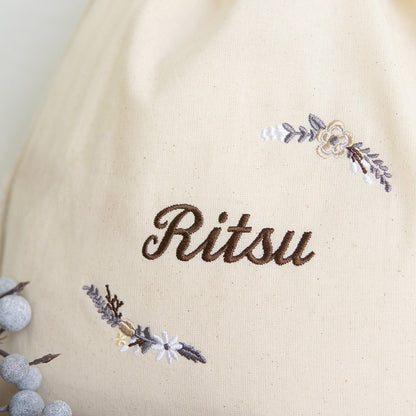 刺繍名入れ 1歳誕生日 一升餅 名前入りリュック・生成り・モデラート