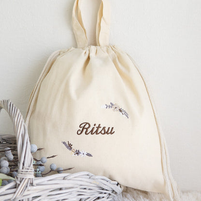 刺繍名入れ 1歳誕生日 一升餅 名前入りリュック・生成り・モデラート