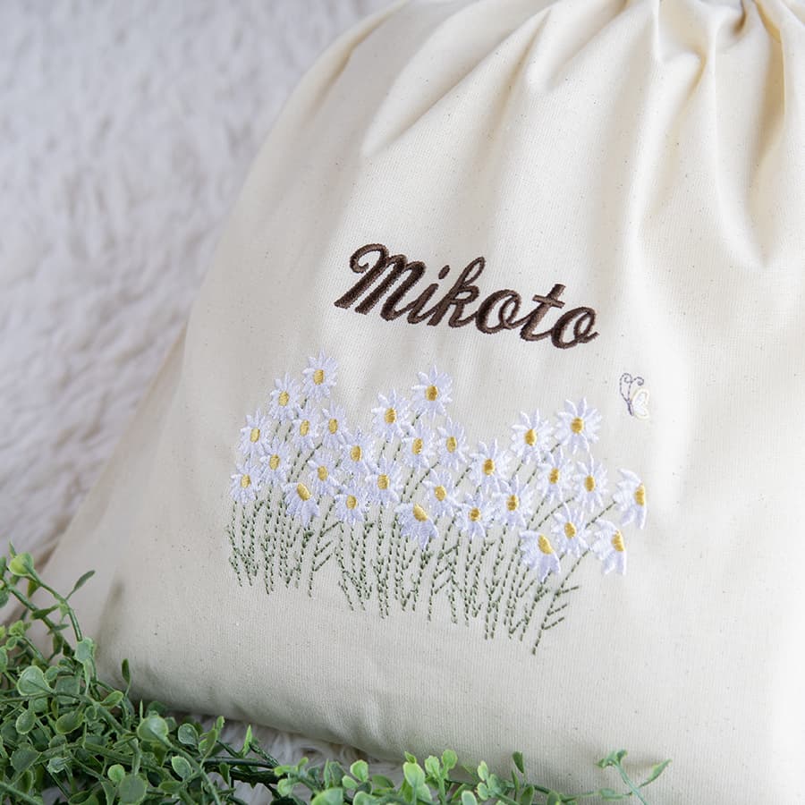 刺繍名入れ 1歳誕生日 一升餅 名前入りリュック・生成り・フルール・ド・コリーヌ