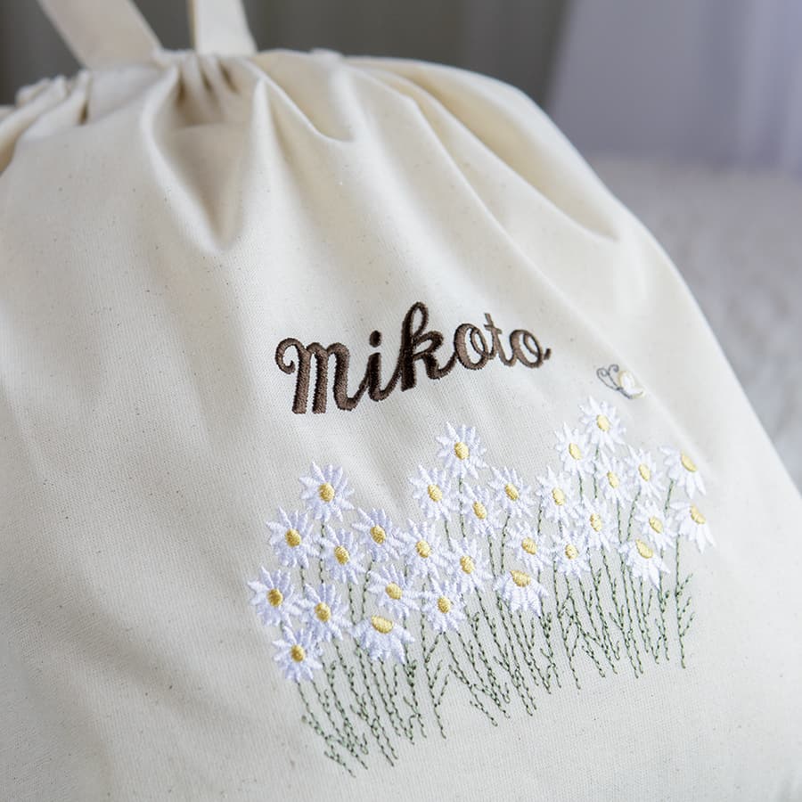 刺繍名入れ 1歳誕生日 一升餅 名前入りリュック・生成り・フルール・ド・コリーヌ